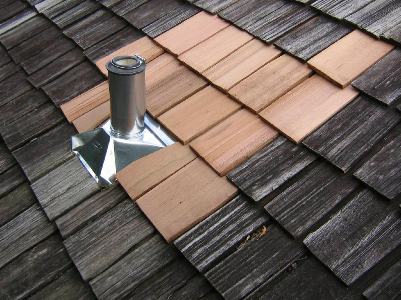 Small wood roof repair around leaking flashing