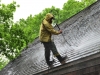 Man Washing a Cedar Roof in Minnesota by Kuhl's Contracting