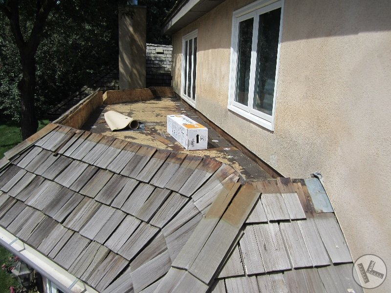 BEFORE: Flat Roof Replaced with Copper in Deephaven
